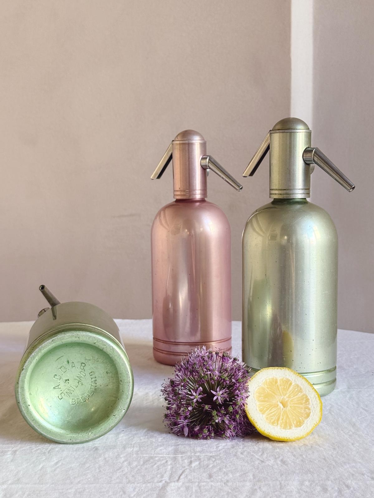 Set of Three 1950s Green and Pink Metal Soda Bottles