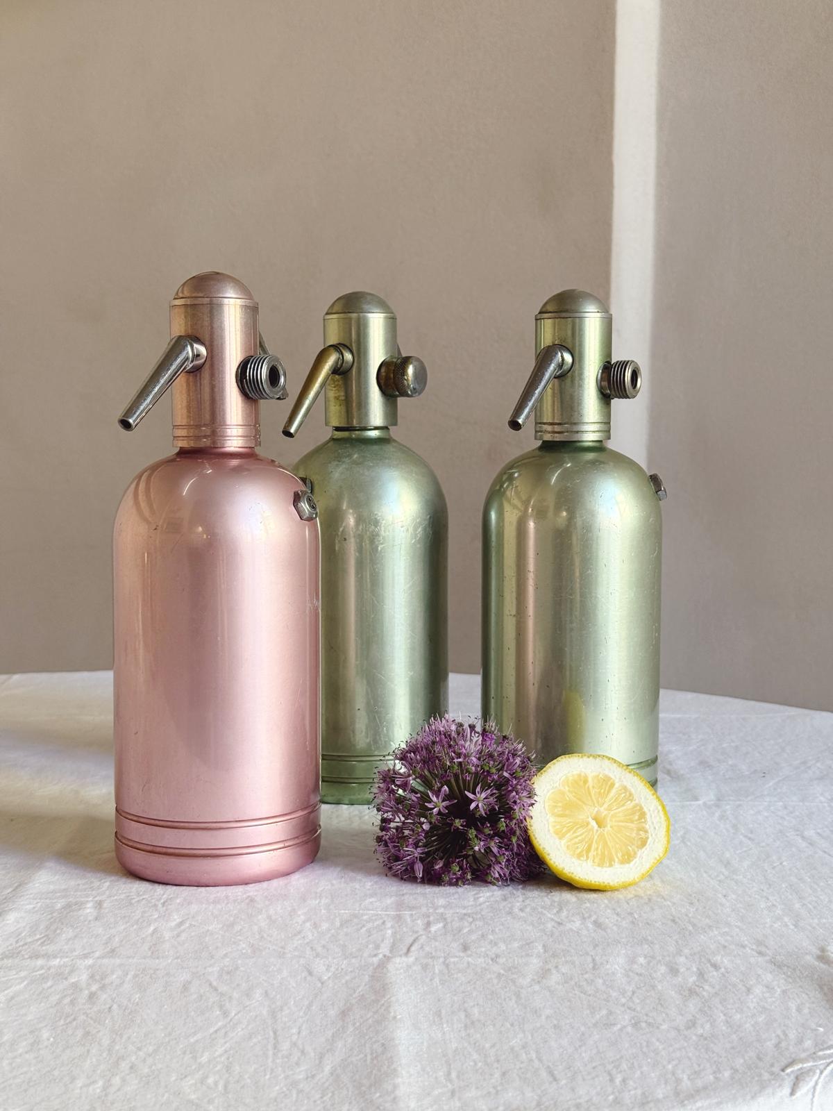 Set of Three 1950s Green and Pink Metal Soda Bottles