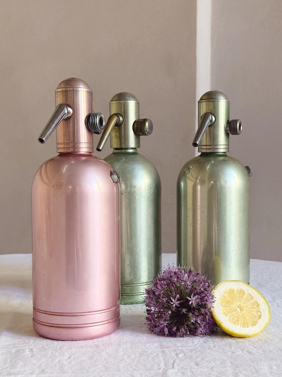 Set of Three 1950s Green and Pink Metal Soda Bottles