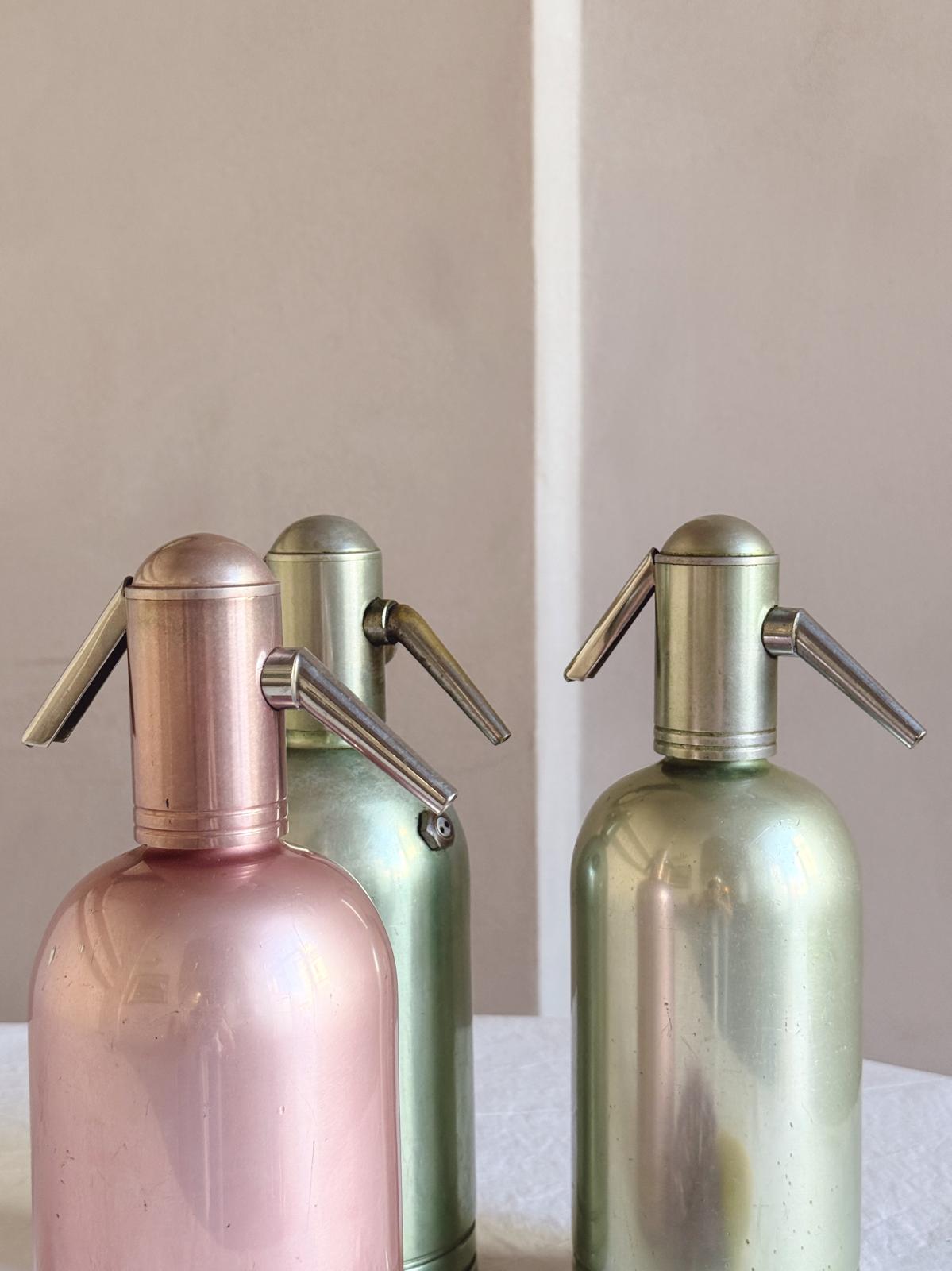 Set of Three 1950s Green and Pink Metal Soda Bottles