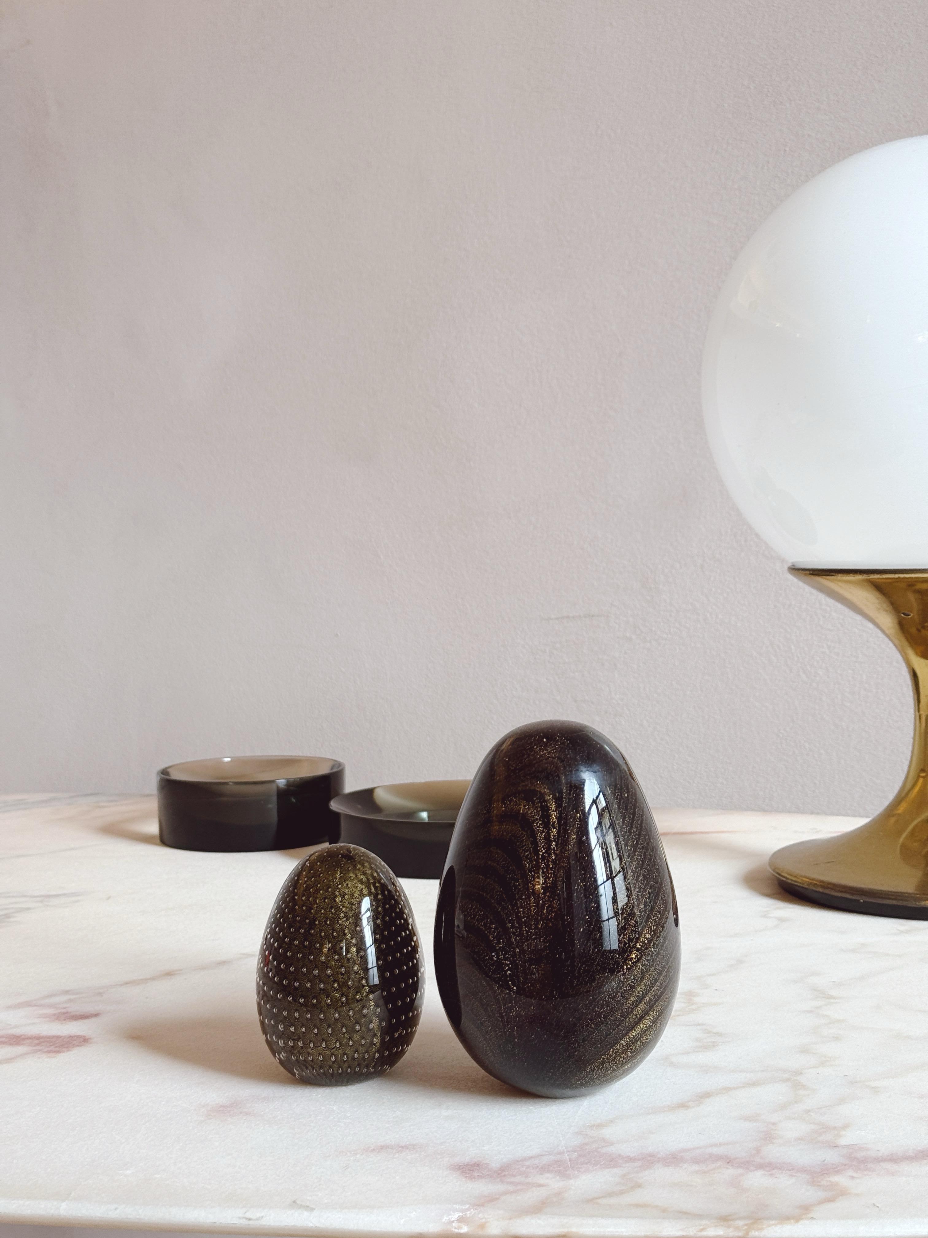 Pair of 1960s Black and gold hand-blown Murano Glass Eggs. By Venini. Signed.