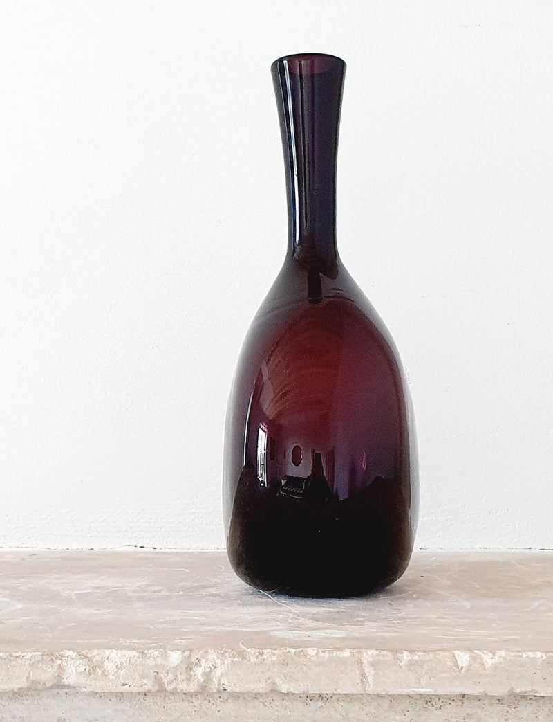 1950s Circular Cranberry Empoli Glass Bottle