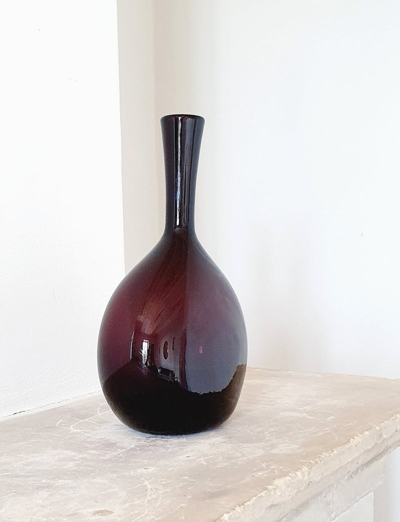 1950s Circular Cranberry Empoli Glass Bottle